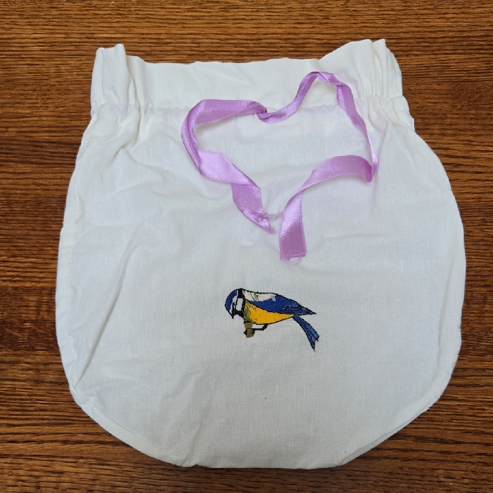 White Bag with Embroidered Bird and Lavender Ribbon